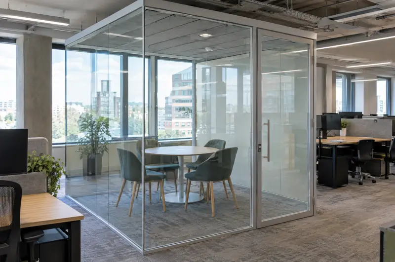 Glazed meeting pod in an open-plan floor. Glazed meeting pod built inside an open-plan office (illustrative)